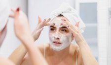 Woman cleansing her face Cleanser for oily skin and acne prone skin